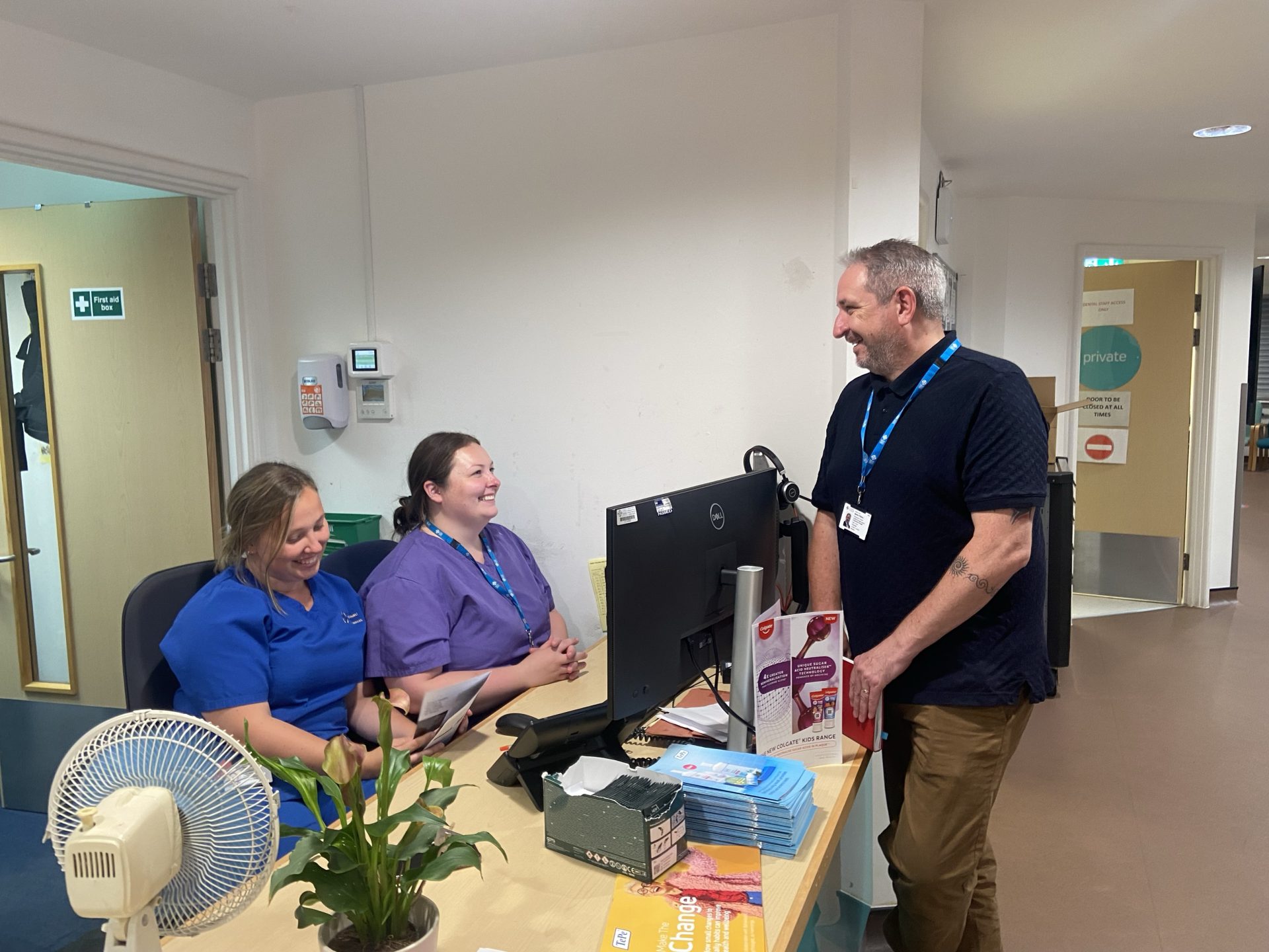 Image of Martin on Charity Team Summer Tour speaking with staff